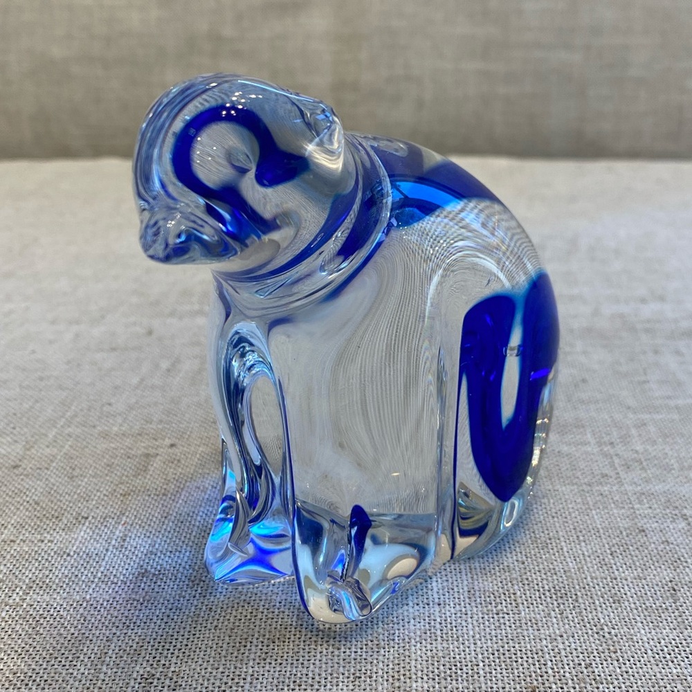 Art glass bear with blue stripe on back side.